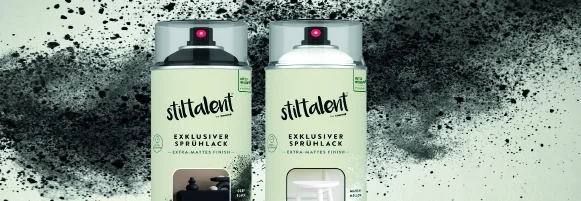 Zwei Sprühdosen mit Farbe